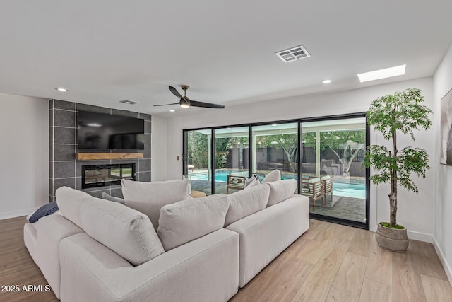 8119 E San Miguel Ave, Scottsdale, AZ 85250 - living area with healthy amount of natural light, light wood-style flooring, recessed lighting, and a ceiling fan