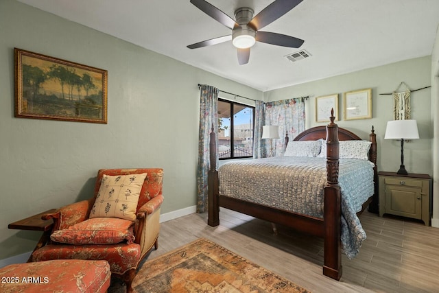 bedroom with visible vents, baseboards, ceiling fan, and light wood finished floors