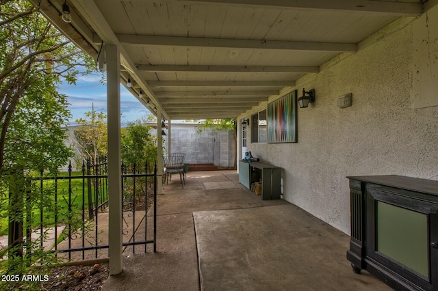 view of patio / terrace featuring fence