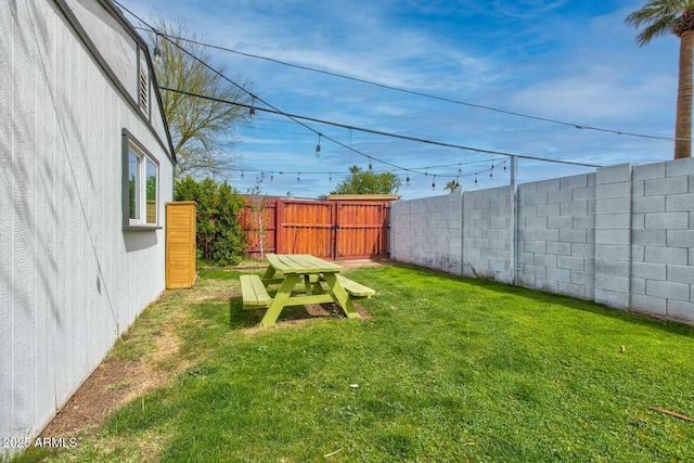 view of yard with a fenced backyard