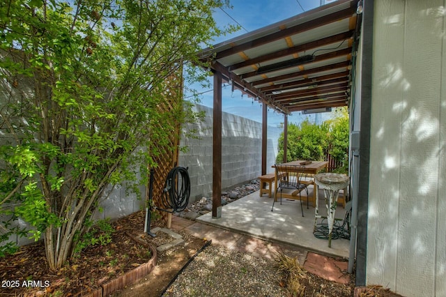 view of patio / terrace featuring outdoor dining space and fence private yard
