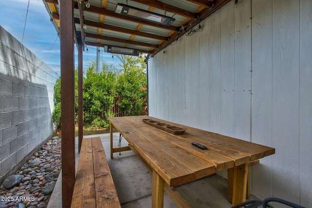 view of patio / terrace with outdoor dining space and fence