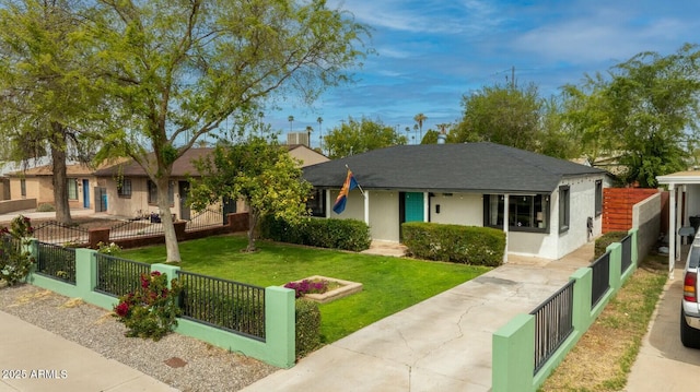 ranch-style house with a front lawn, a fenced front yard, and stucco siding