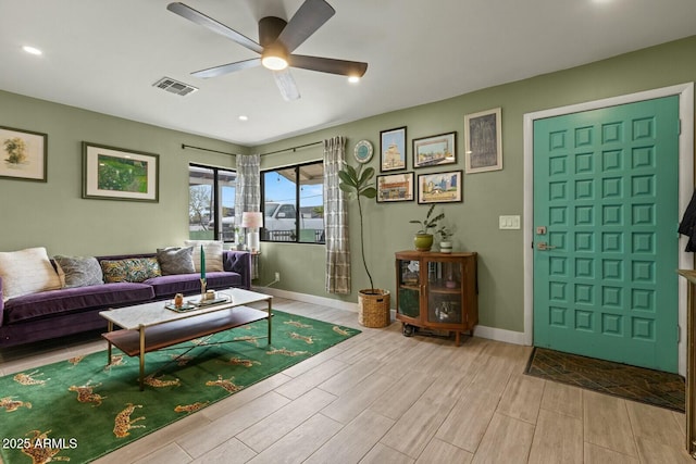 living area with visible vents, baseboards, wood tiled floor, recessed lighting, and a ceiling fan