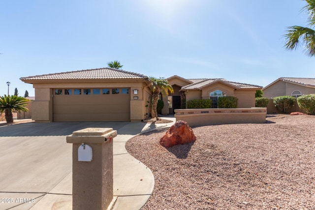 view of front of house featuring driveway, stucco siding, a garage, and a tiled roof