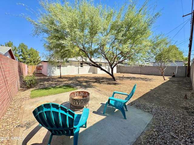 view of patio / terrace with a fire pit