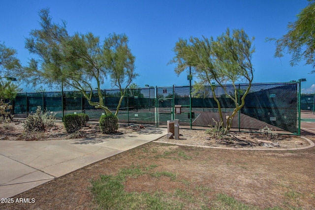 view of sport court with fence