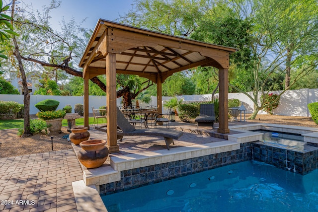 view of pool featuring a gazebo and a patio