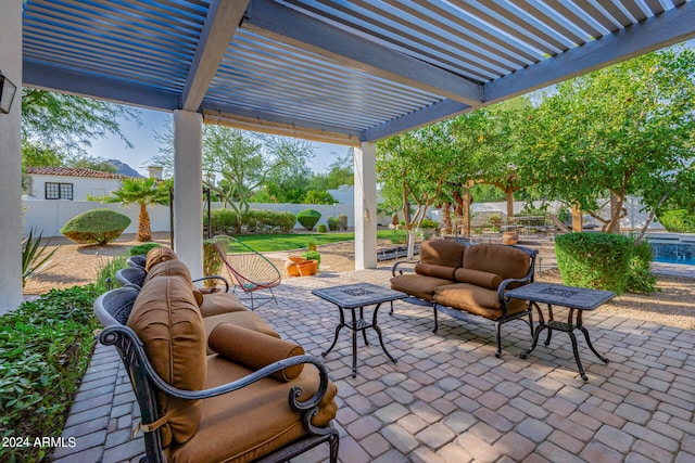 view of patio / terrace with an outdoor living space and a pergola