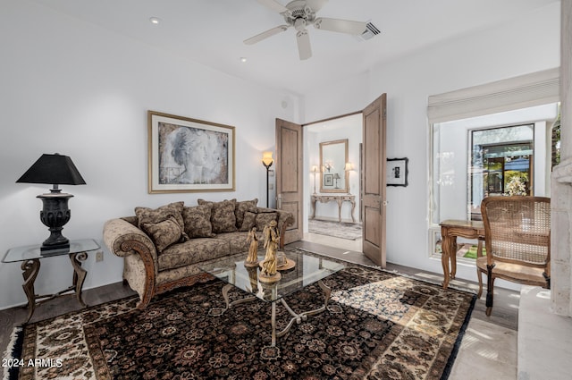 living room with light hardwood / wood-style floors and ceiling fan