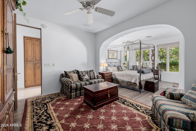 bedroom with ceiling fan and wood-type flooring