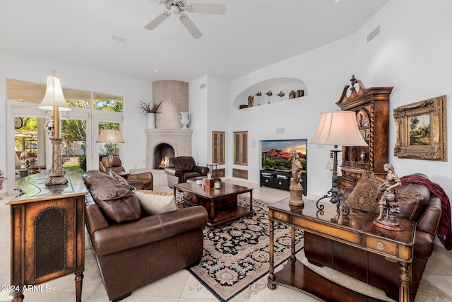 living room featuring light tile patterned floors and ceiling fan