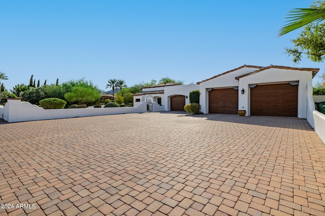 mediterranean / spanish-style home featuring a garage