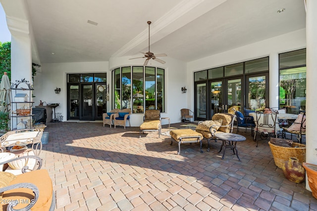 view of patio / terrace featuring ceiling fan and french doors