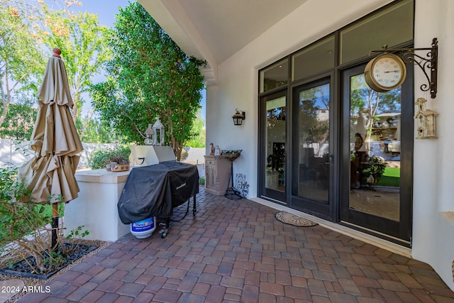 view of patio with a grill