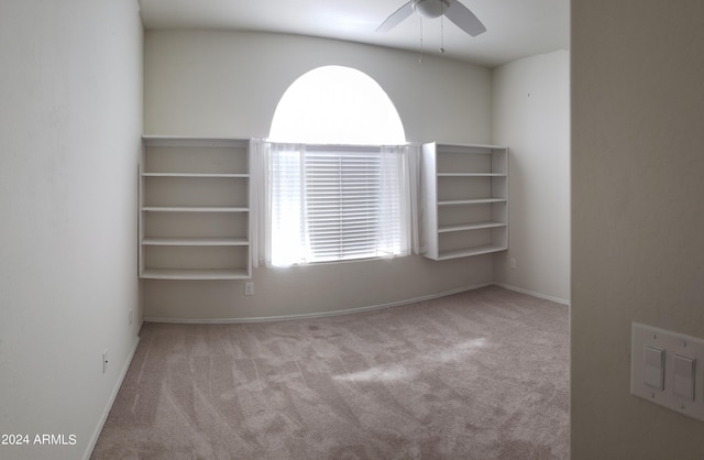 empty room featuring light carpet and ceiling fan