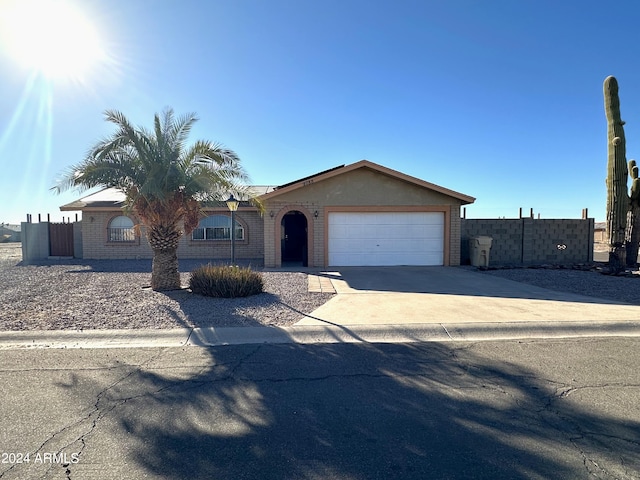 ranch-style house featuring a garage