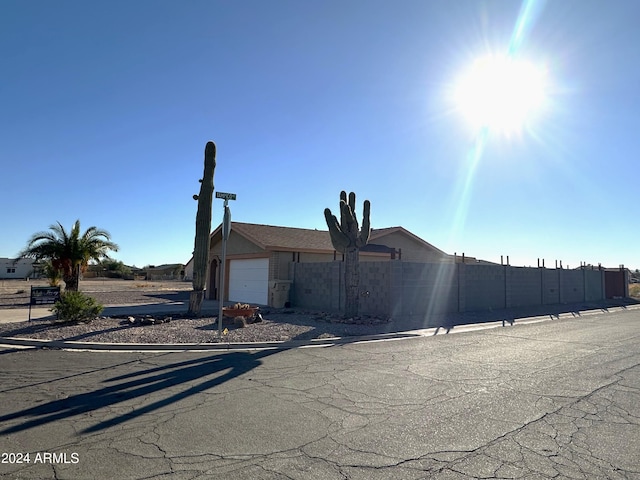 view of side of property with a garage