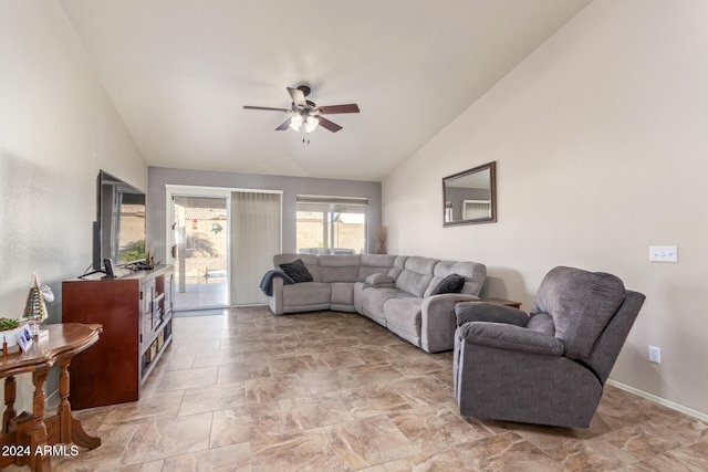 living room featuring ceiling fan and lofted ceiling