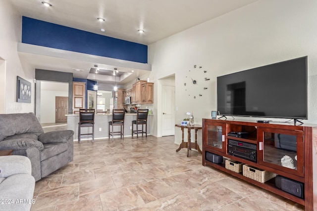 living room featuring a high ceiling