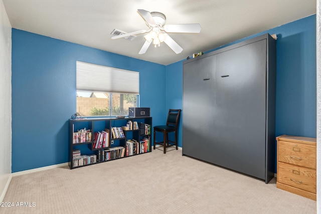 recreation room with light colored carpet and ceiling fan