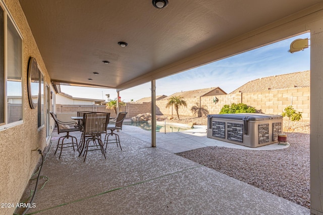 view of patio / terrace featuring a fenced in pool