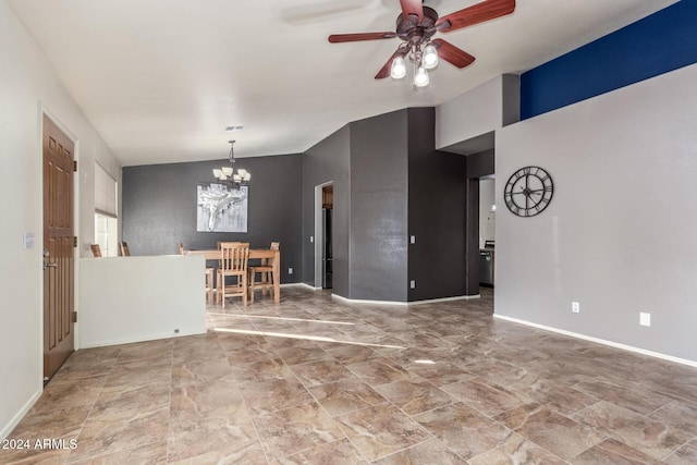 spare room featuring ceiling fan with notable chandelier