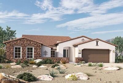 mediterranean / spanish-style home featuring stone siding, a tile roof, an attached garage, and stucco siding