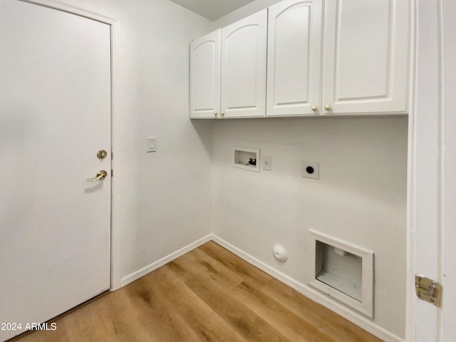 laundry area with cabinets, washer hookup, electric dryer hookup, light hardwood / wood-style floors, and hookup for a gas dryer