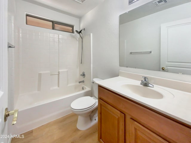 full bathroom featuring wood-type flooring, vanity, toilet, and shower / washtub combination