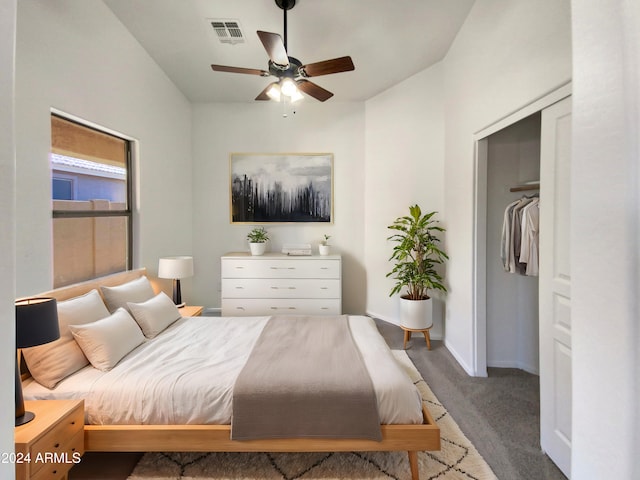 carpeted bedroom with a closet and ceiling fan