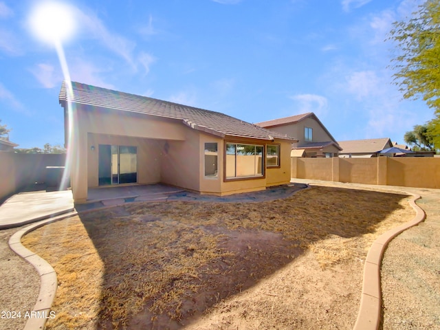 rear view of property with a patio area