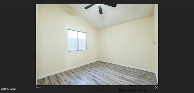 spare room with vaulted ceiling, light hardwood / wood-style flooring, and ceiling fan