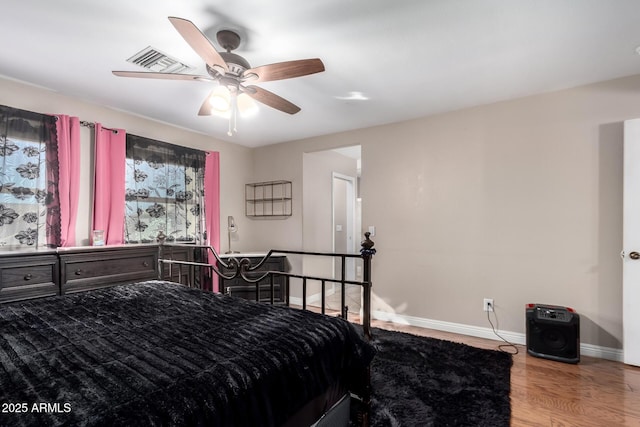 bedroom with hardwood / wood-style flooring and ceiling fan