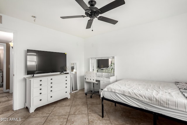 tiled bedroom with ceiling fan