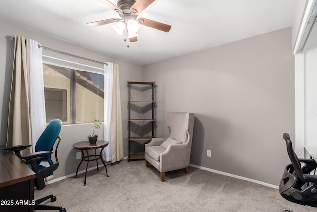 carpeted home office with ceiling fan