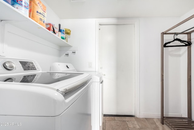 laundry area with washing machine and dryer