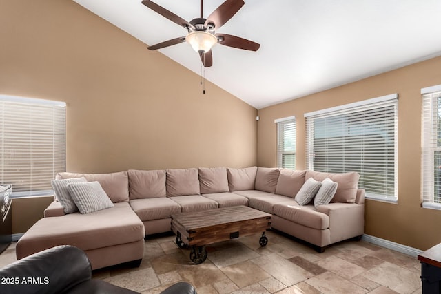 living room with ceiling fan and vaulted ceiling