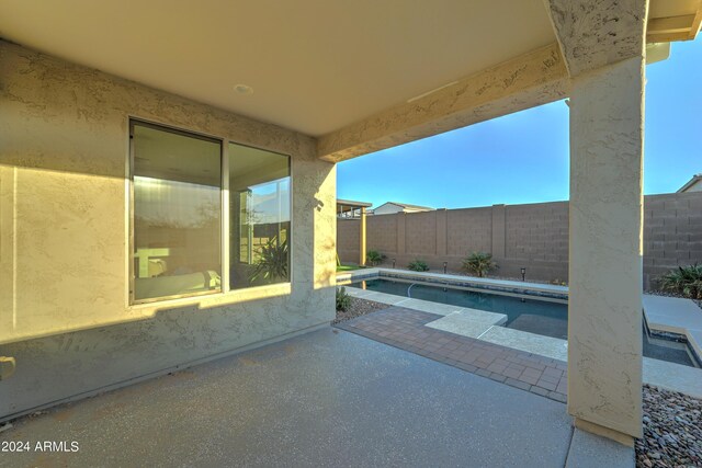 view of patio / terrace featuring a fenced in pool