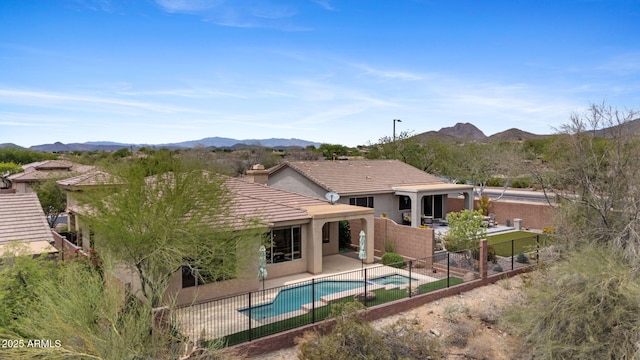 41627 N Cedar Chase Rd, Anthem, AZ 85086 - back of house featuring a patio, stucco siding, a mountain view, and a tiled roof