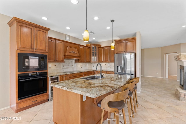 41627 N Cedar Chase Rd, Anthem, AZ 85086 - kitchen featuring black appliances, beverage cooler, a sink, brown cabinetry, and light tile patterned flooring