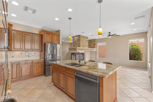 41627 N Cedar Chase Rd, Anthem, AZ 85086 - kitchen with stainless steel appliances, a sink, light tile patterned floors, a ceiling fan, and tasteful backsplash
