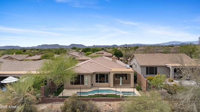 41627 N Cedar Chase Rd, Anthem, AZ 85086 - back of property featuring stucco siding, a fenced backyard, and a mountain view