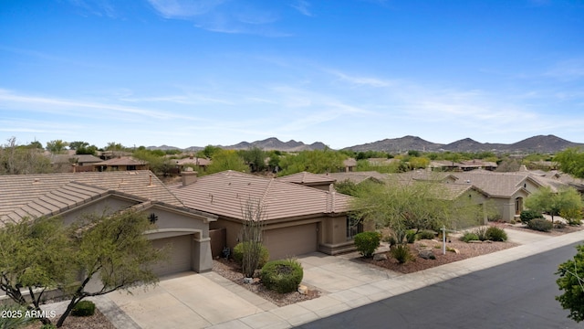 41627 N Cedar Chase Rd, Anthem, AZ 85086 - ranch-style home with an attached garage, a tile roof, concrete driveway, and stucco siding
