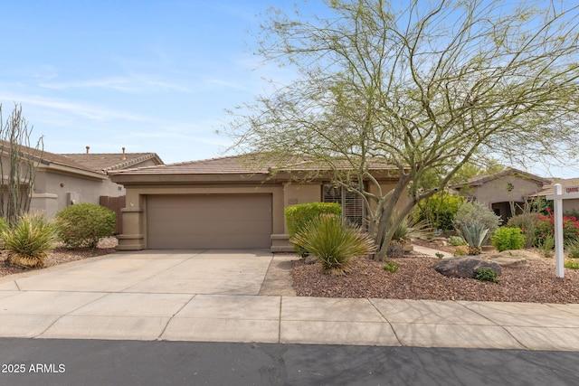 41627 N Cedar Chase Rd, Anthem, AZ 85086 - view of front of house featuring stucco siding, a garage, and concrete driveway