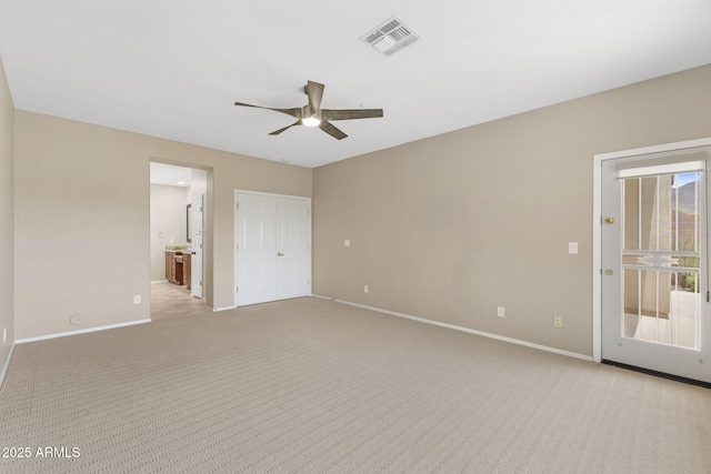 41627 N Cedar Chase Rd, Anthem, AZ 85086 - unfurnished bedroom featuring baseboards, light colored carpet, ensuite bath, and a ceiling fan