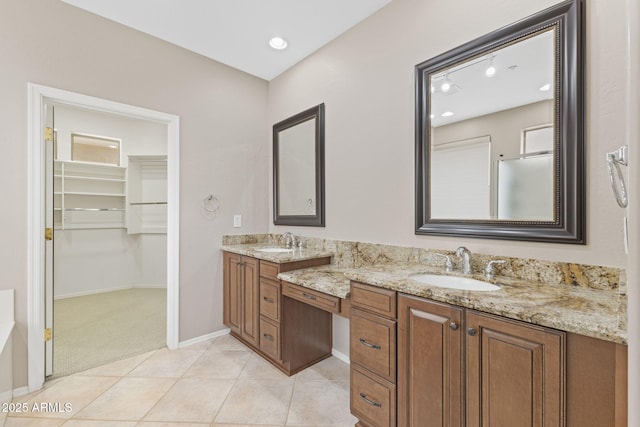 41627 N Cedar Chase Rd, Anthem, AZ 85086 - bathroom with double vanity, a spacious closet, baseboards, tile patterned flooring, and recessed lighting