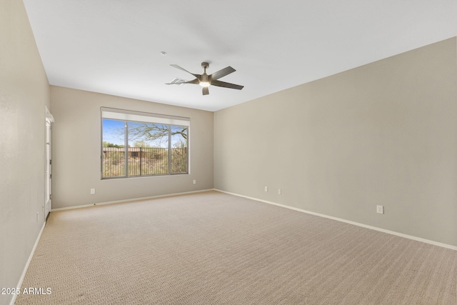 41627 N Cedar Chase Rd, Anthem, AZ 85086 - spare room with a ceiling fan, baseboards, and light carpet