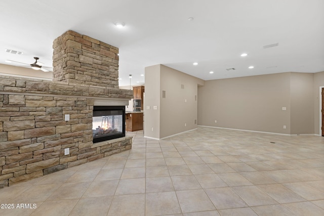 41627 N Cedar Chase Rd, Anthem, AZ 85086 - unfurnished living room featuring ceiling fan, a fireplace, light tile patterned floors, baseboards, and recessed lighting