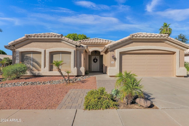 mediterranean / spanish house featuring a garage